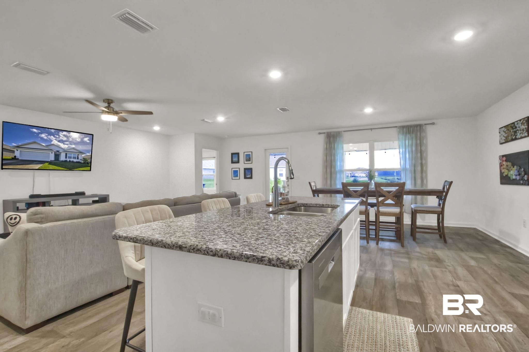 23810 Unbridled Loop Daphne, AL 36526 - Photo 13 of 50 Kitchen with ceiling fan, dishwasher, white cabinetry, and light hardwood / wood-style flooring