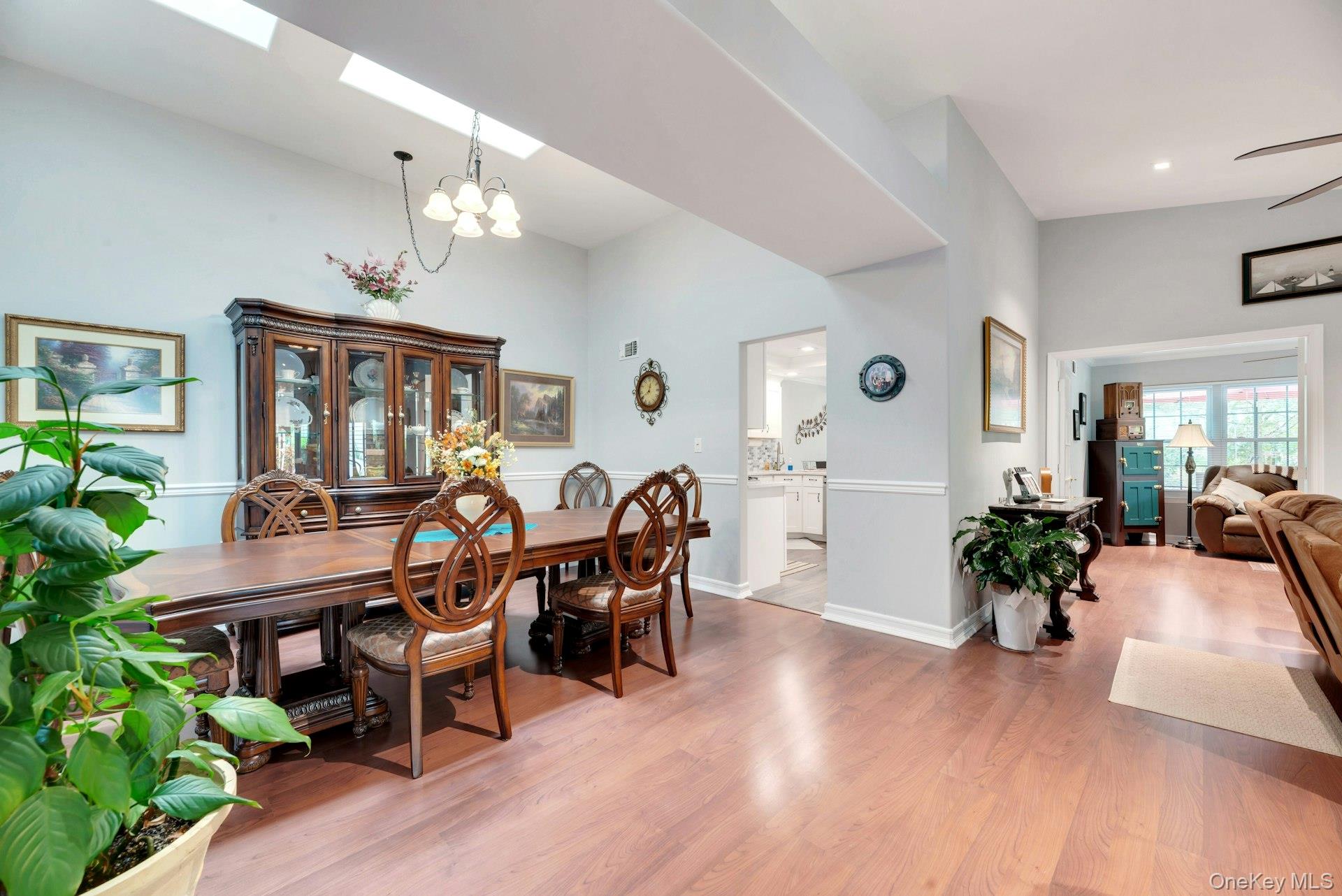 104 Glen Drive Ridge, NY 11961 - Photo 11 of 25 a view of a dining room with furniture window and wooden floor