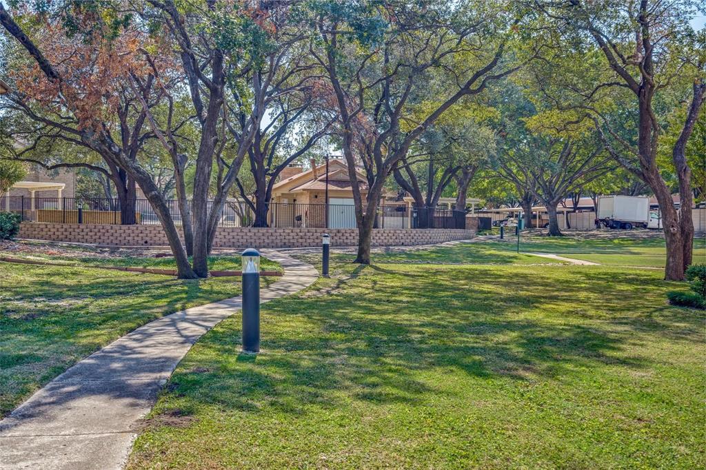 16301 Ledgemont Lane, Unit 262 Addison, TX 75001 - Photo 22 of 25 a view of a park with large trees