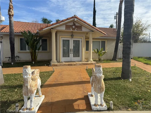 a view of a house with a street