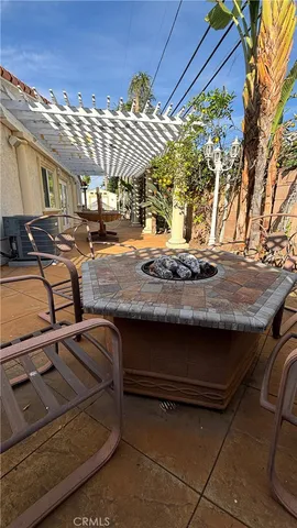a patio with a table and chairs