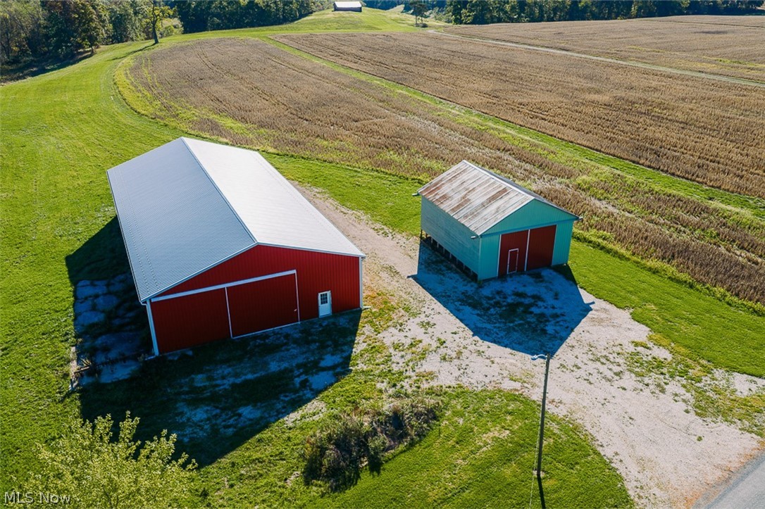 15 Glecoe Road Southwest Carrollton, OH 44615 - Photo 6 of 50 Aerial view of sparsely populated area with rows of crops