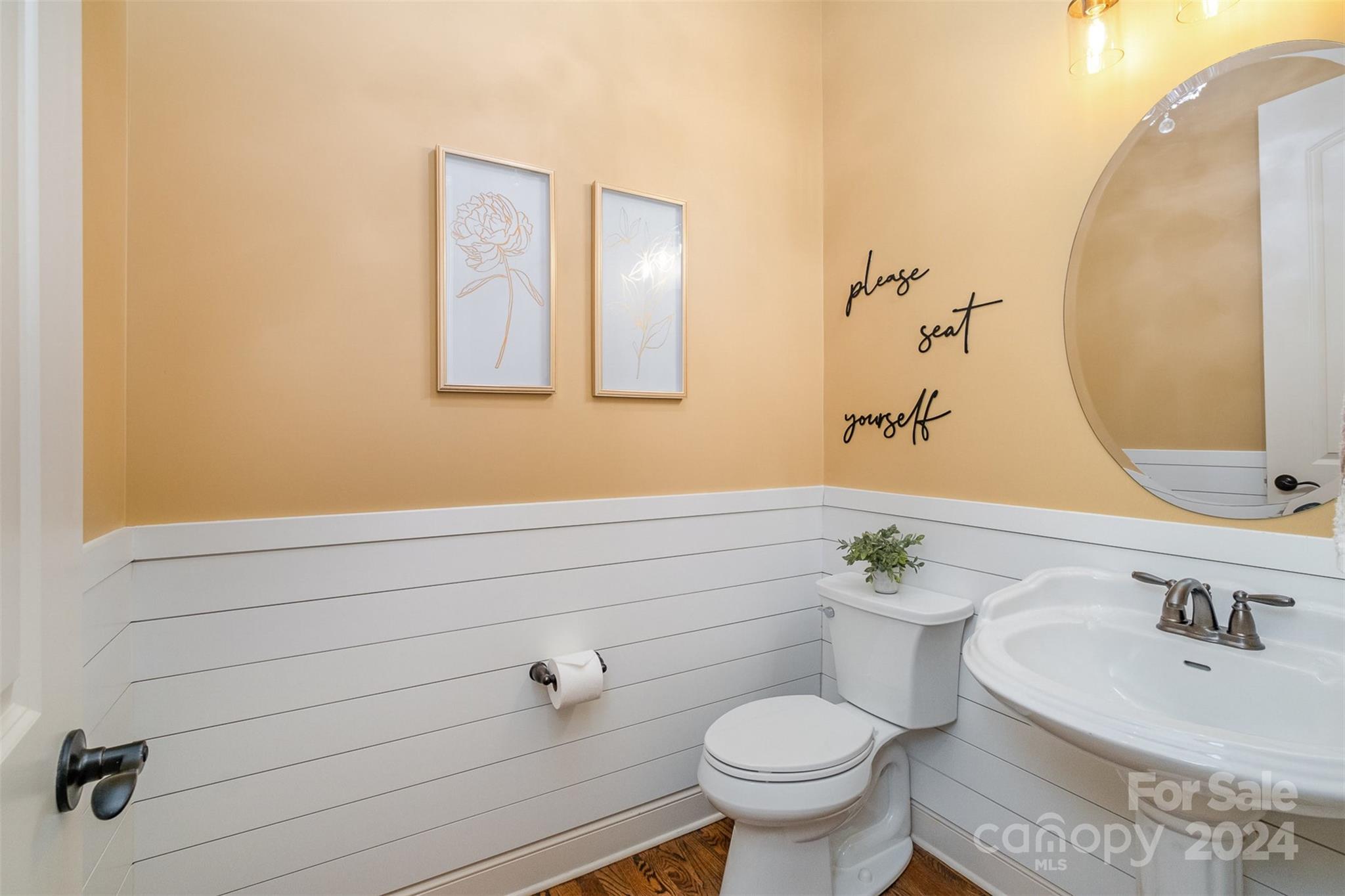 6926 Potter Road Weddington, NC 28104 - Photo 17 of 46 a bathroom with a sink and a mirror