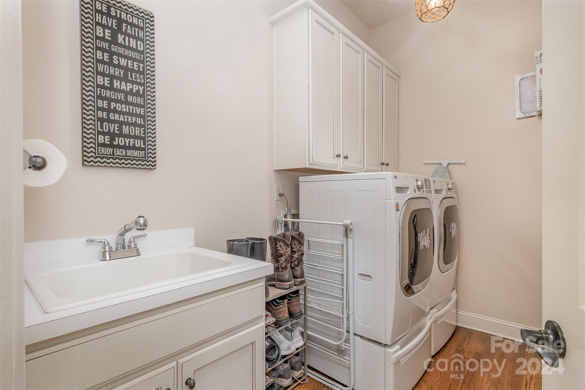 6926 Potter Road Weddington, NC 28104 - Photo 18 of 46 a utility room with dryer and washer