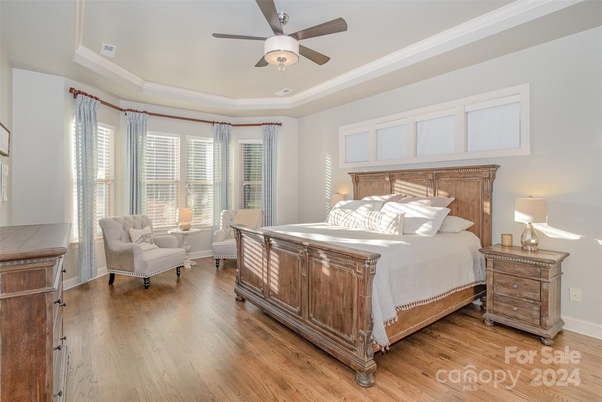 6926 Potter Road Weddington, NC 28104 - Photo 19 of 46 a bed room with a bed and a couch