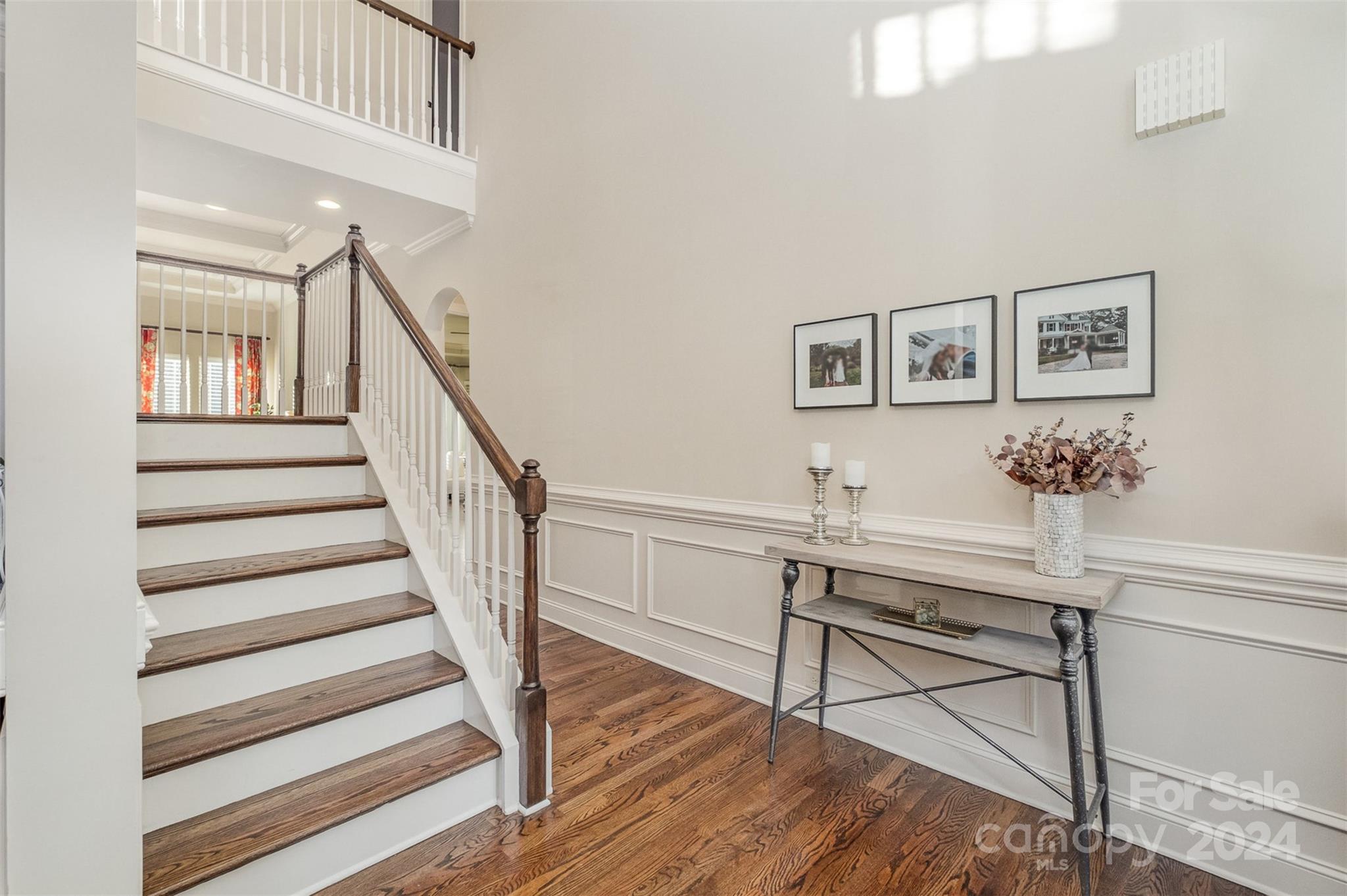 6926 Potter Road Weddington, NC 28104 - Photo 2 of 46 a view of entryway and hall with wooden floor