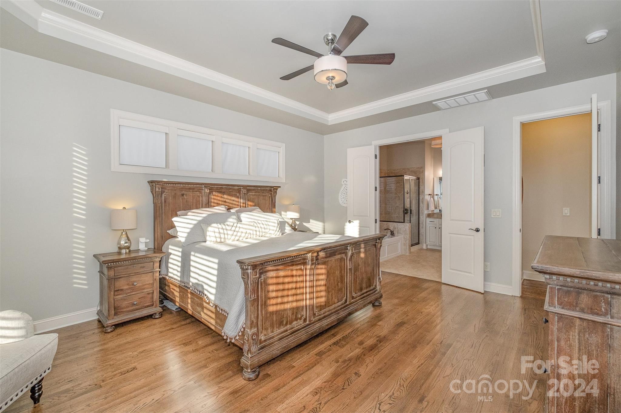 6926 Potter Road Weddington, NC 28104 - Photo 21 of 46 a bedroom with a bed and wooden floor
