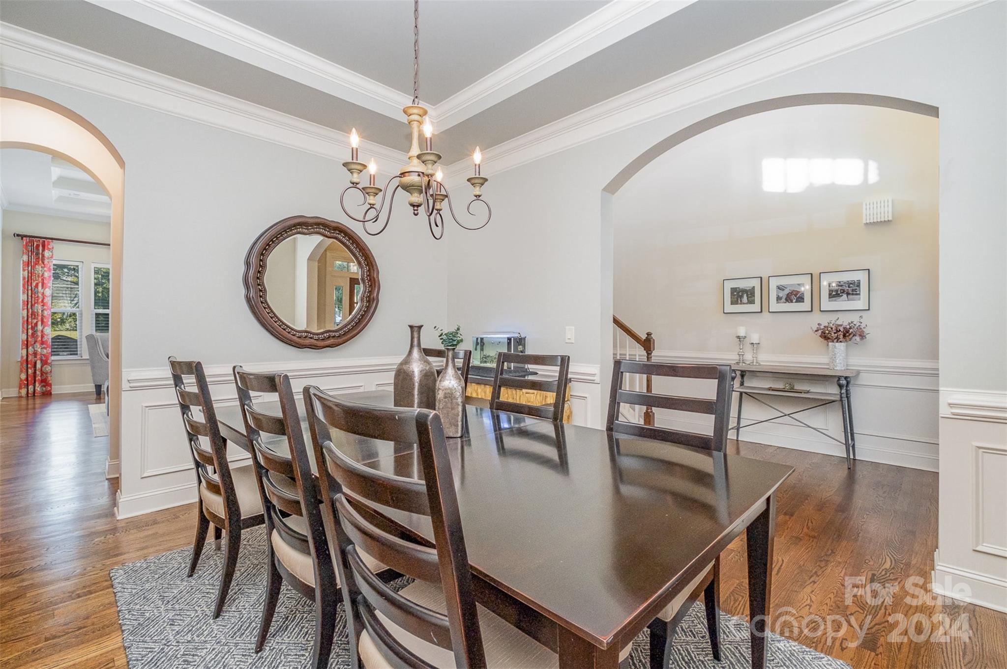 6926 Potter Road Weddington, NC 28104 - Photo 3 of 46 a view of a dining room with furniture and a chandelier