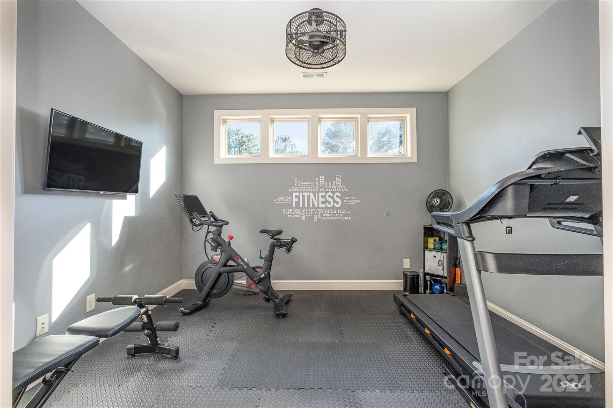 6926 Potter Road Weddington, NC 28104 - Photo 31 of 46 a view of a workspace with furniture and a window