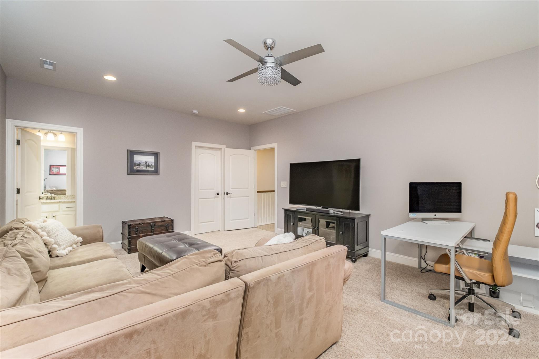 6926 Potter Road Weddington, NC 28104 - Photo 37 of 46 a living room with furniture and a flat screen tv