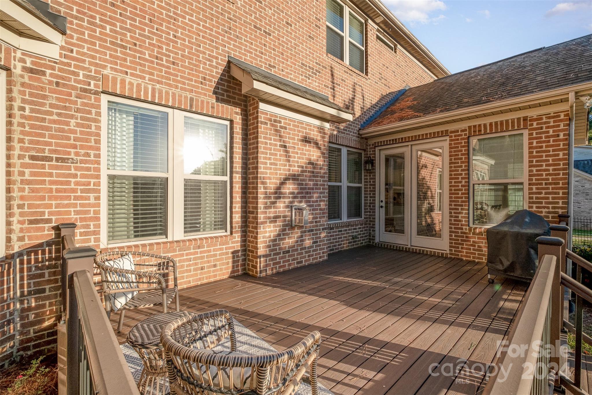 6926 Potter Road Weddington, NC 28104 - Photo 39 of 46 a view of a patio with table and chairs and wooden floor