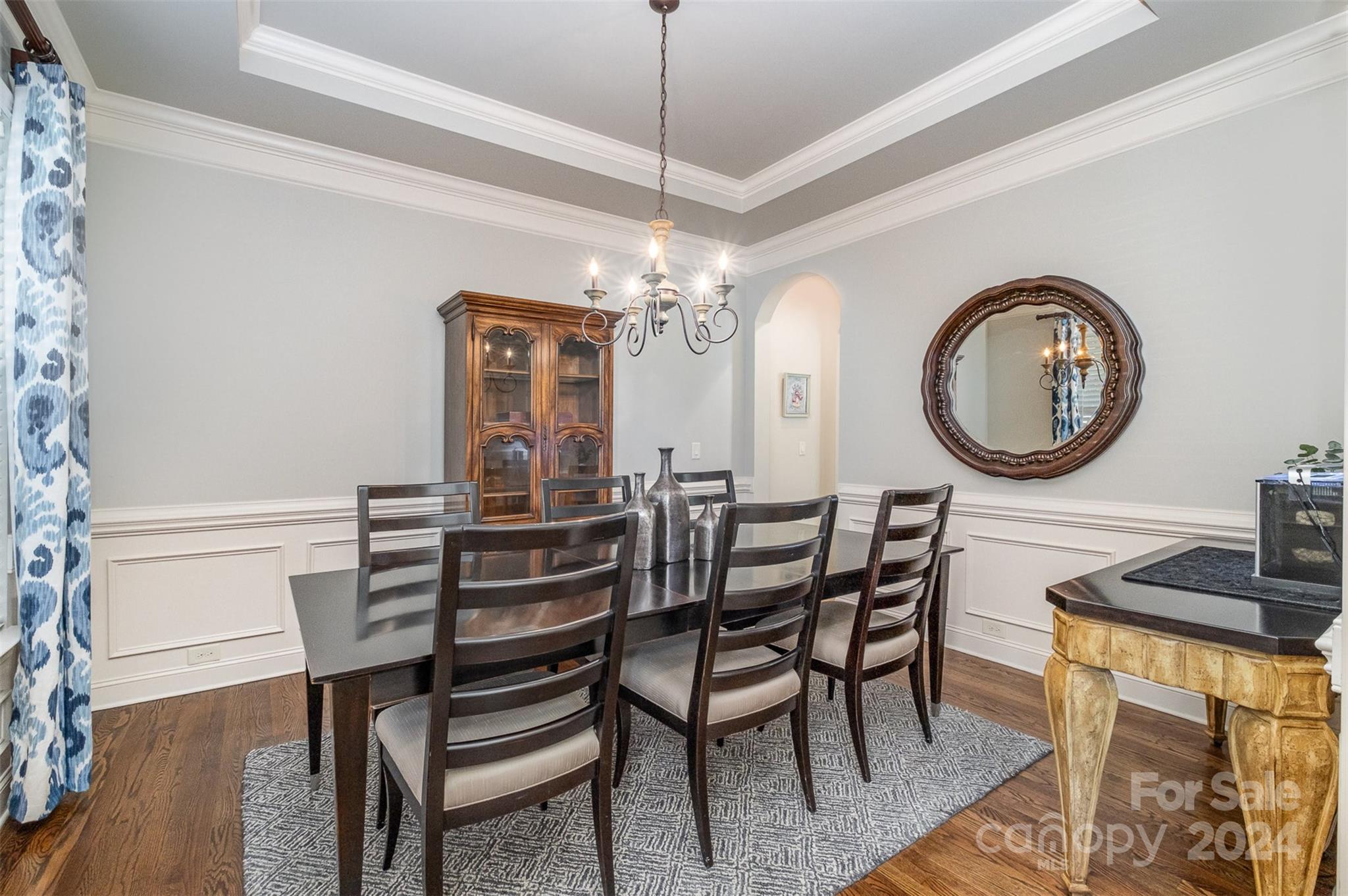6926 Potter Road Weddington, NC 28104 - Photo 4 of 46 a view of a dining room with furniture and chandelier