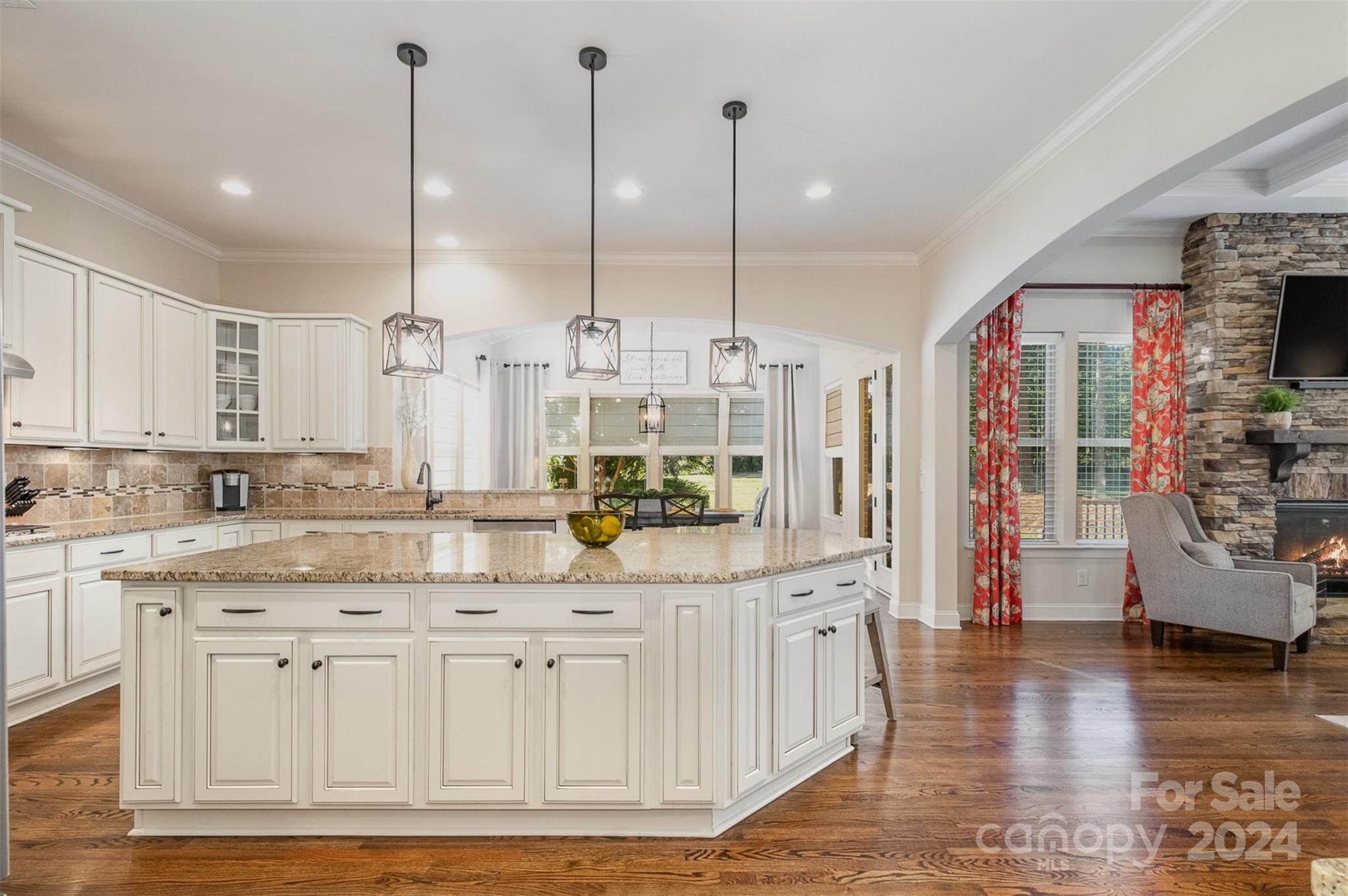 6926 Potter Road Weddington, NC 28104 - Photo 9 of 46 a large kitchen with cabinets and wooden floor