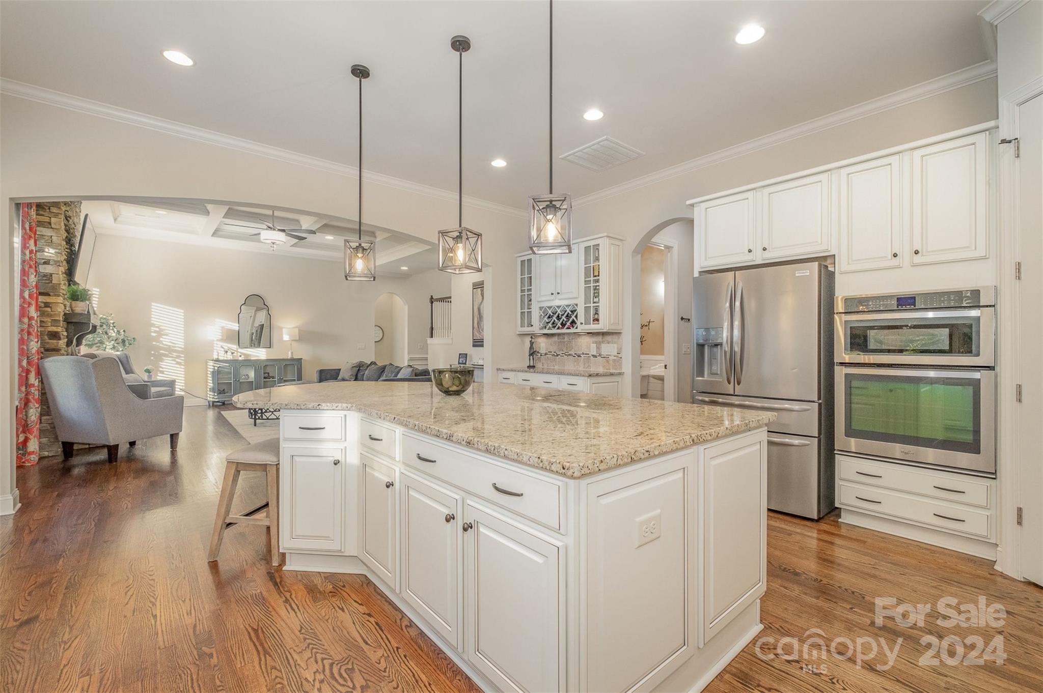 6926 Potter Road Weddington, NC 28104 - Photo 10 of 46 a kitchen with kitchen island a counter top space a sink appliances and cabinets