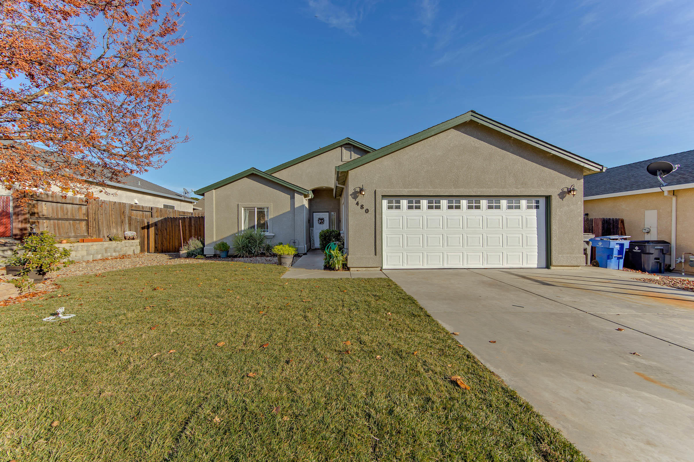 480 Springtime Lane Red Bluff, CA 96080 - Photo 1 of 20 a front view of a house with a yard and garage