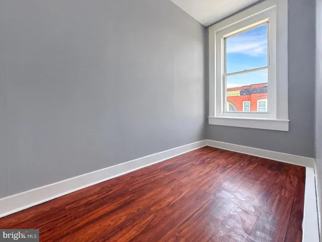a view of a big room with wooden floor