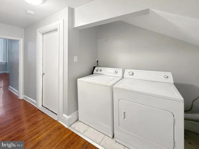 a kitchen with stainless steel appliances a stove a sink and a refrigerator