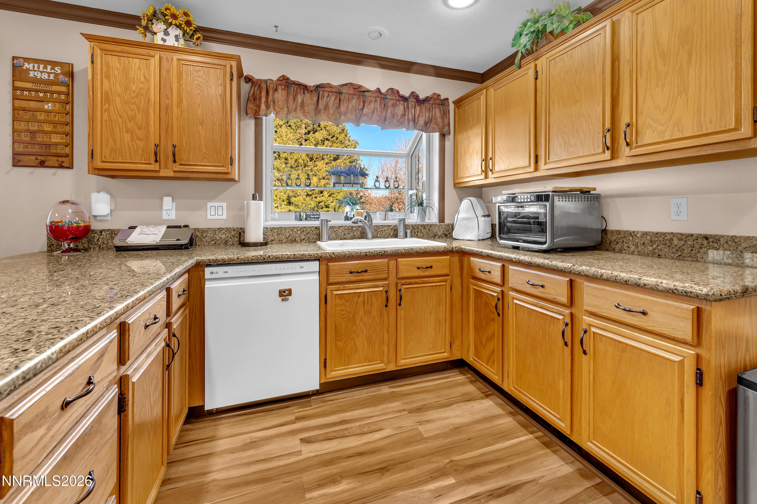 7879 White Falls Court Reno, NV 89506 - Photo 13 of 42 a kitchen with stainless steel appliances granite countertop a sink stove and cabinets