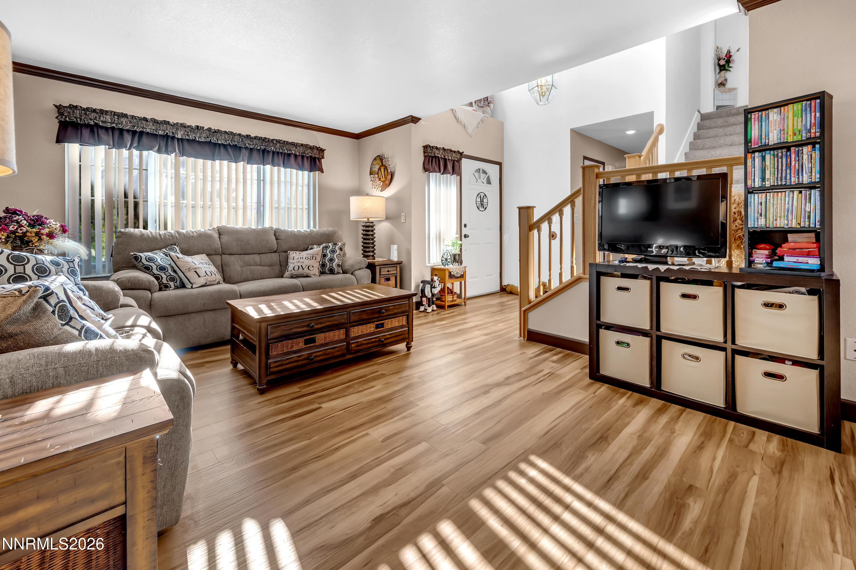 7879 White Falls Court Reno, NV 89506 - Photo 17 of 42 a living room with furniture flat screen tv and wooden floor