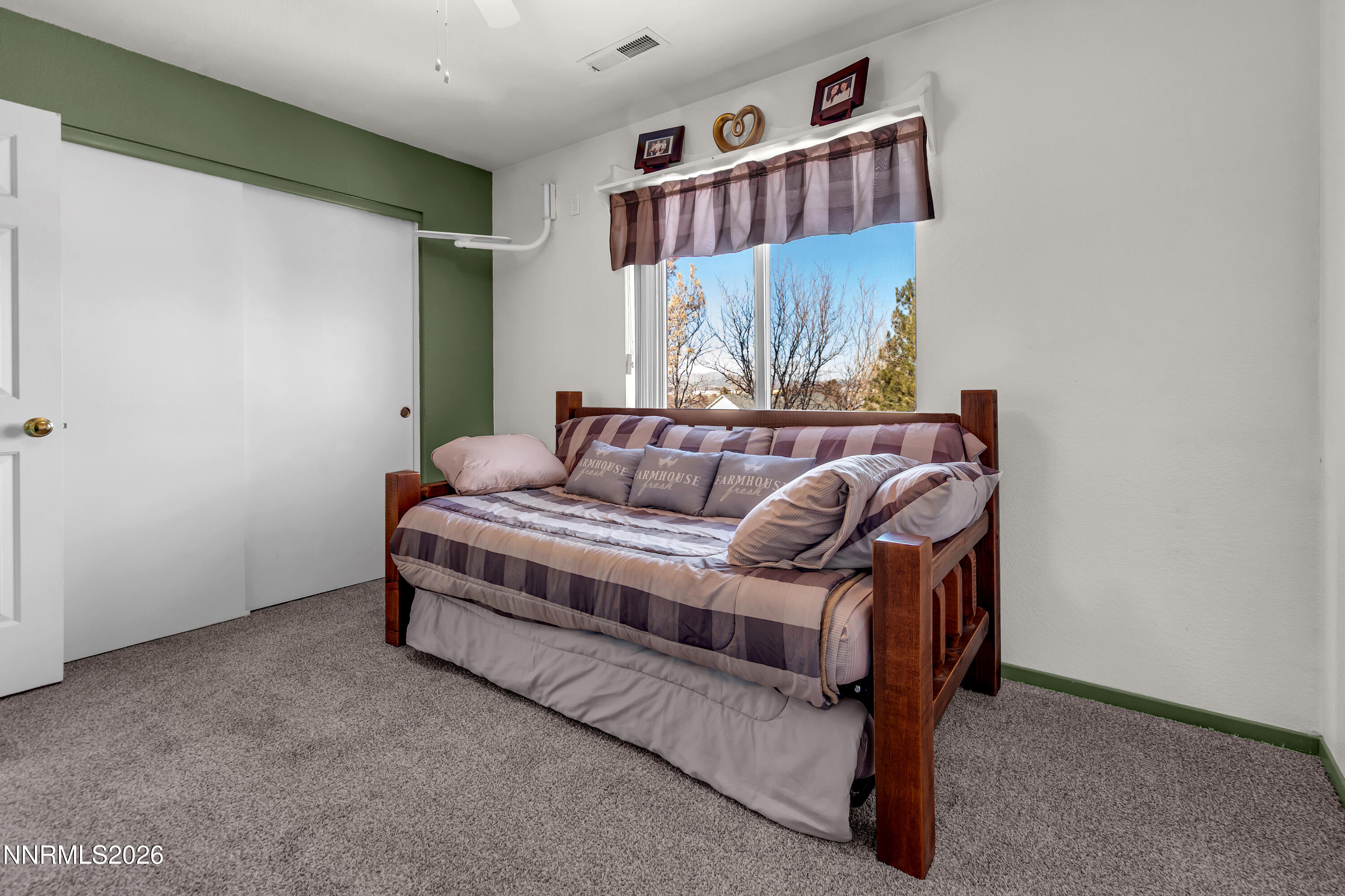 7879 White Falls Court Reno, NV 89506 - Photo 28 of 42 a bedroom with a bed and window