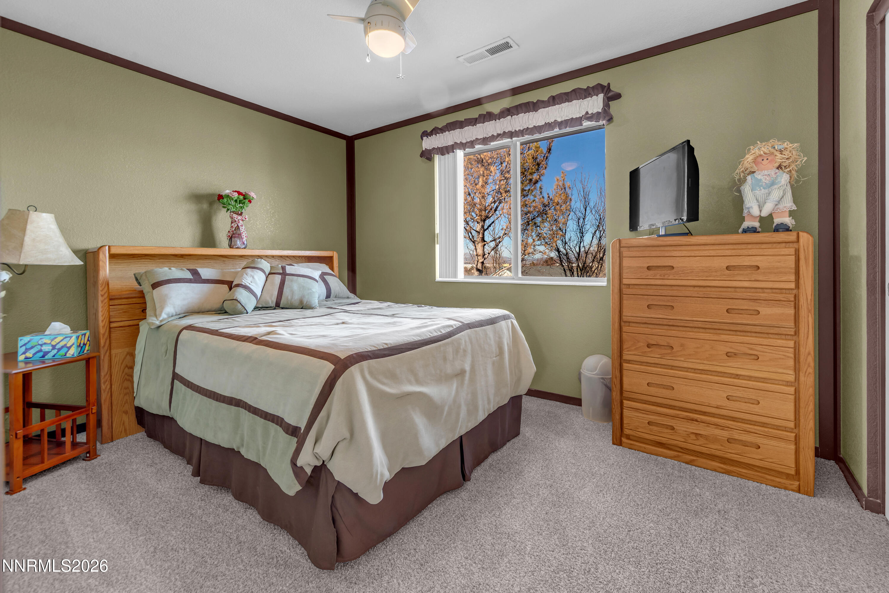 7879 White Falls Court Reno, NV 89506 - Photo 29 of 42 a bedroom with a bed and a dresser