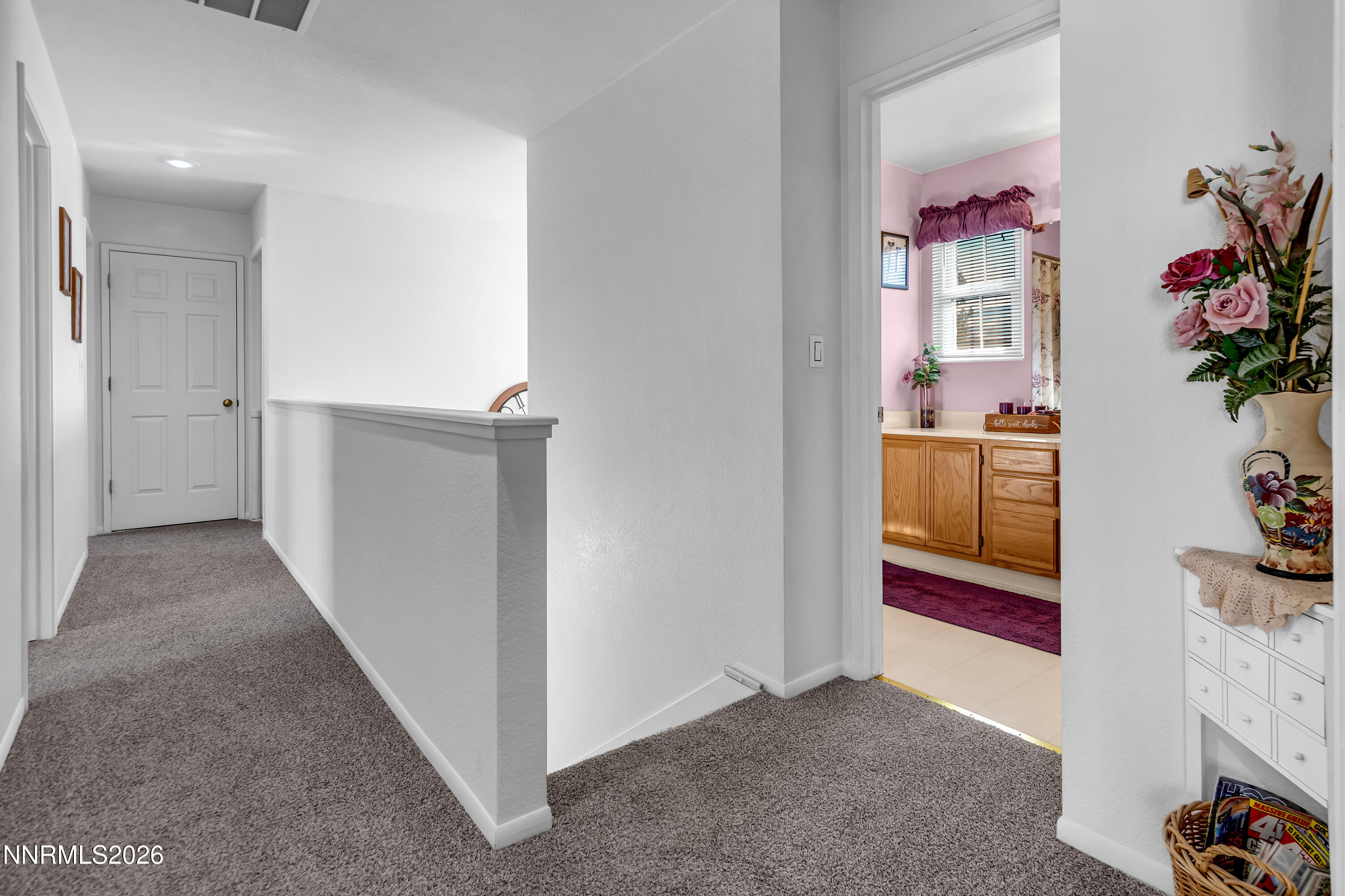 7879 White Falls Court Reno, NV 89506 - Photo 30 of 42 a view of hallway with window and flower pot