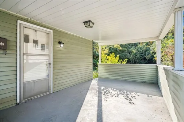 a view of a porch with a bench