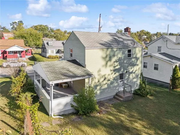 a aerial view of a house with a yard