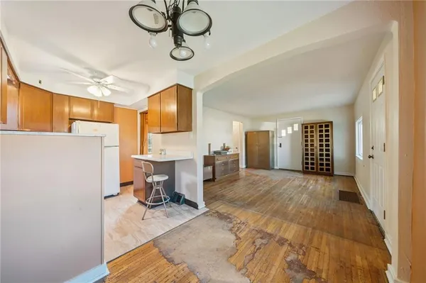 a view of livingroom with kitchen island furniture and a window