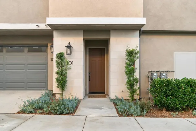 a front view of a house with a garage