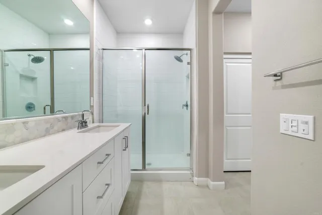 a bathroom with a toilet a sink and a mirror