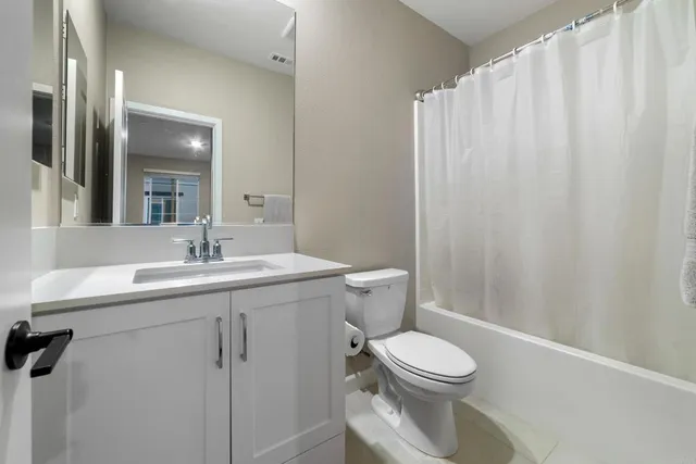 a view of a hallway with washer and dryer