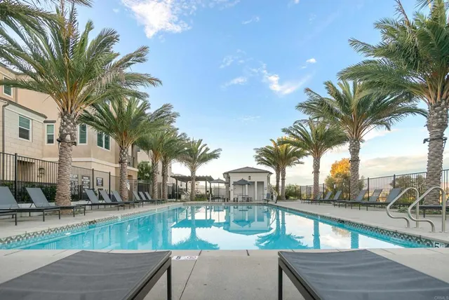 a view of outdoor space with swimming pool and lounge chair