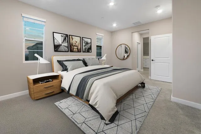 a bed room with a bed and a window