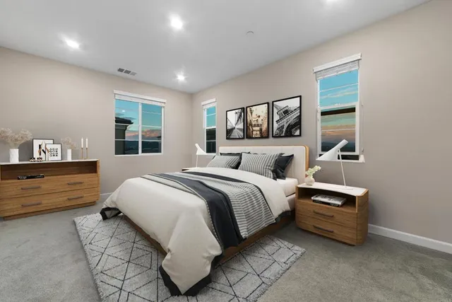 a bedroom with bed and a window