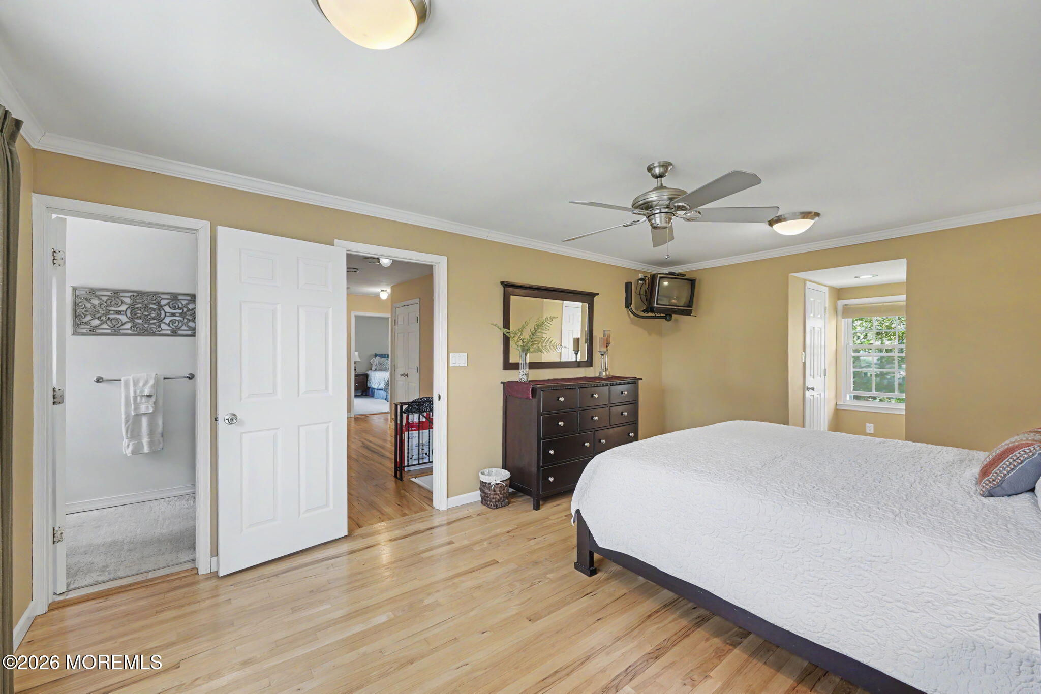 49 Hampton Drive Freehold, NJ 07728 - Photo 18 of 34 a spacious bedroom with a bed and a chandelier