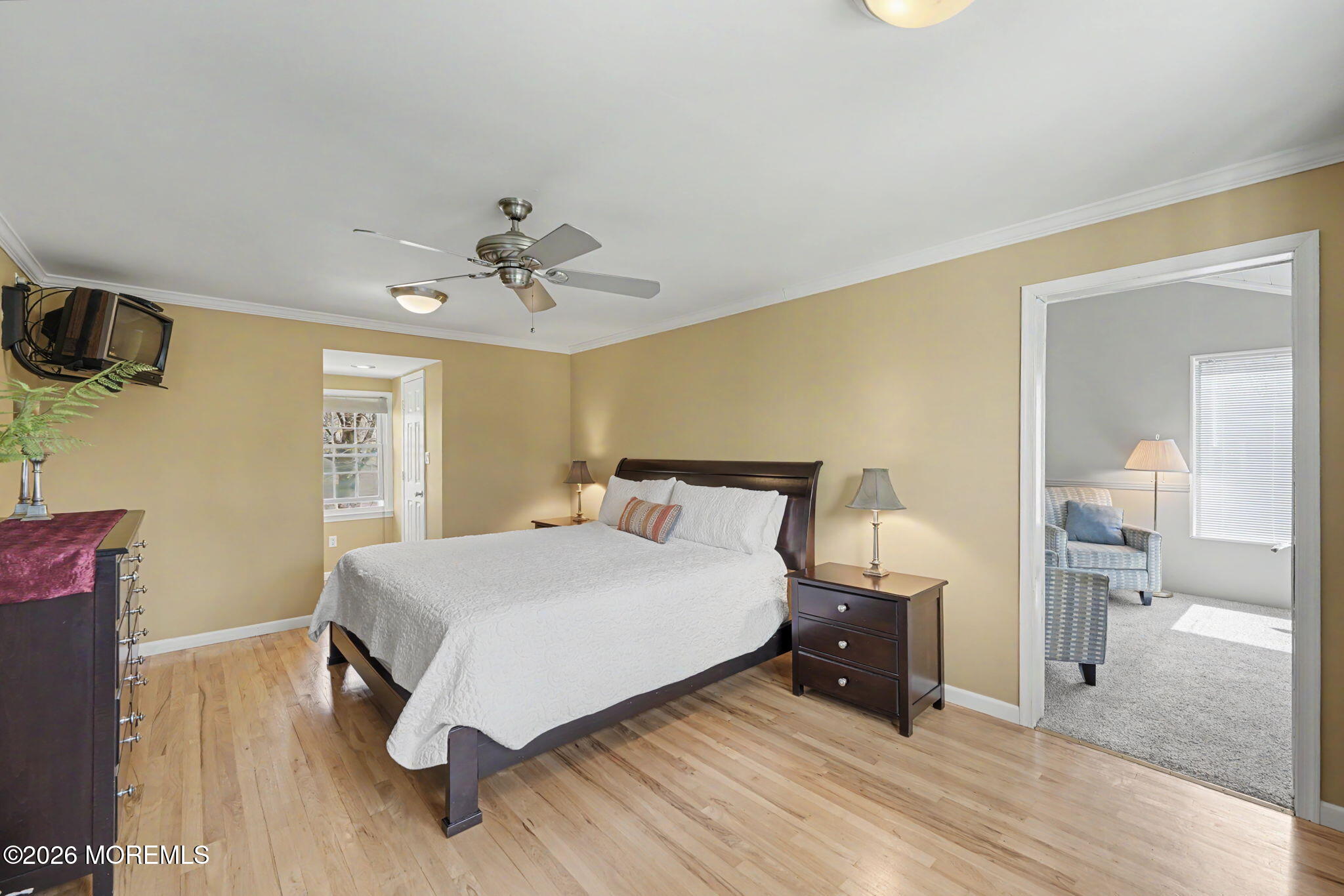 49 Hampton Drive Freehold, NJ 07728 - Photo 19 of 34 a bedroom with a bed and wooden floor