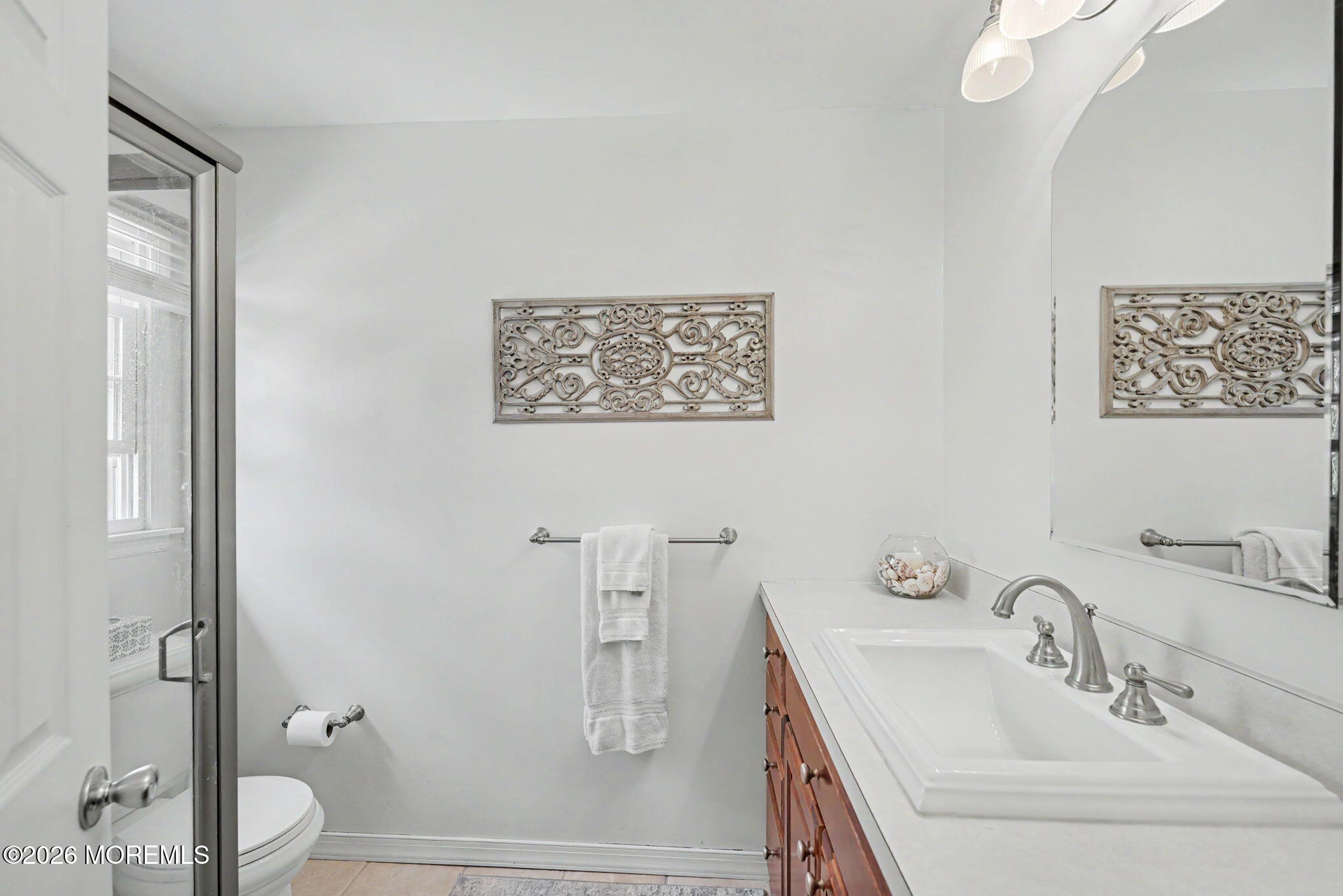 49 Hampton Drive Freehold, NJ 07728 - Photo 20 of 34 a bathroom with a sink a toilet and a large mirror