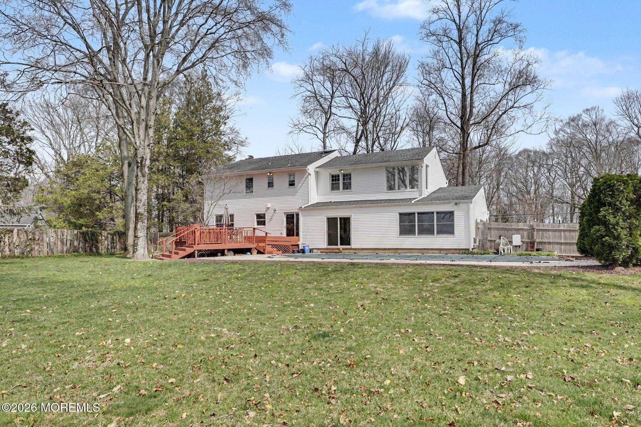 49 Hampton Drive Freehold, NJ 07728 - Photo 30 of 34 a white house that has a tree in front of it