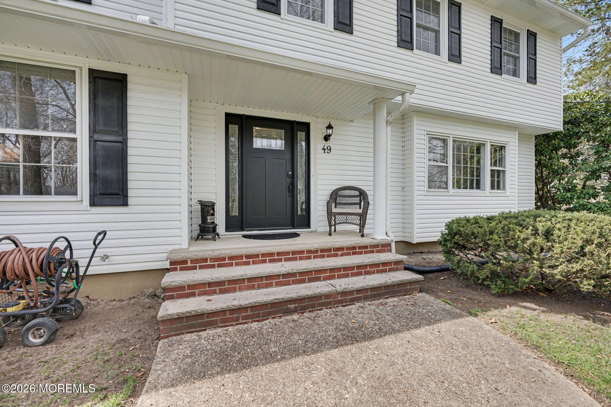 49 Hampton Drive Freehold, NJ 07728 - Photo 3 of 34 a view of a house with sitting area and garden