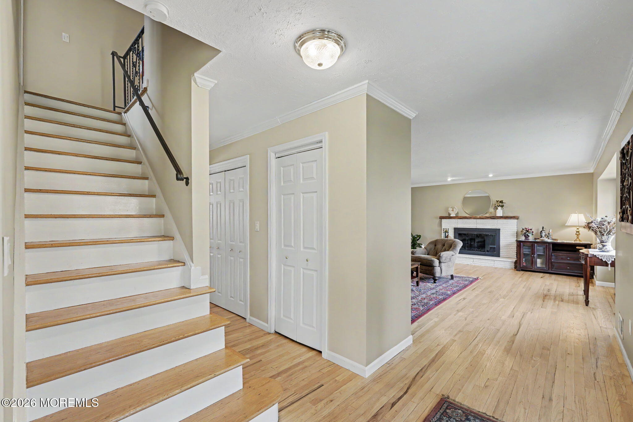 49 Hampton Drive Freehold, NJ 07728 - Photo 5 of 34 a view of a livingroom with hardwood floor and a ceiling fan