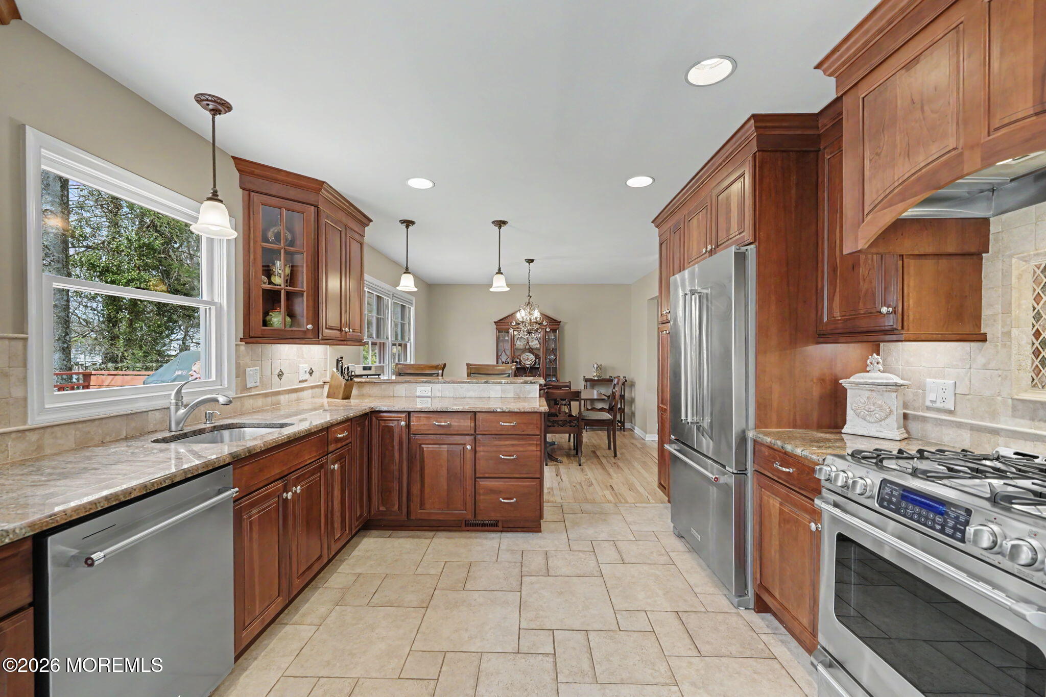49 Hampton Drive Freehold, NJ 07728 - Photo 8 of 34 a kitchen with stainless steel appliances granite countertop a sink a stove a refrigerator and a oven