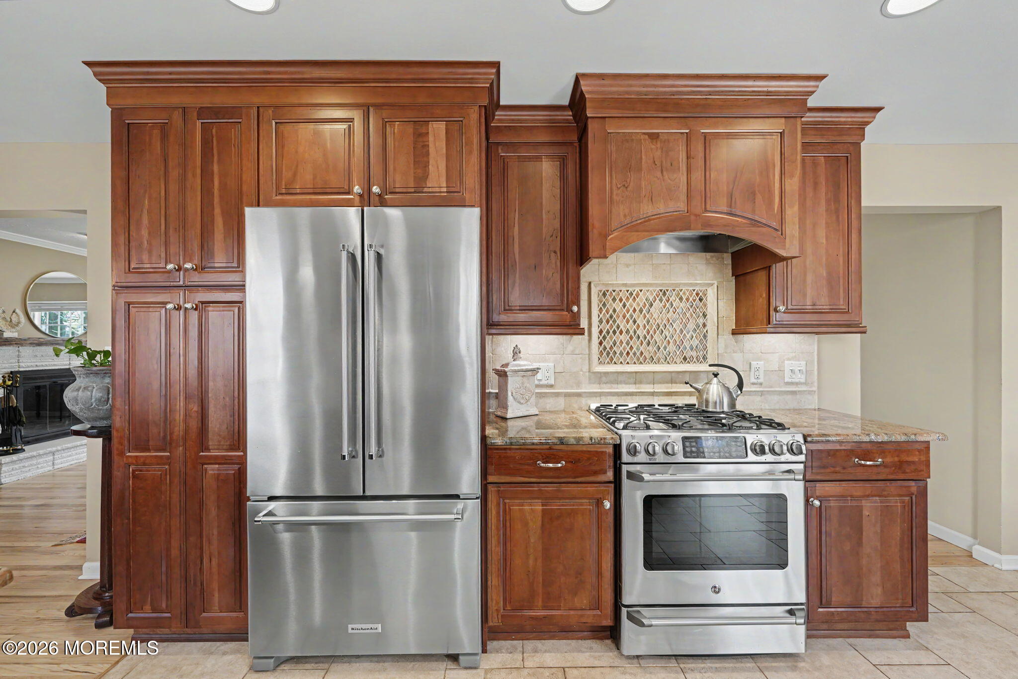 49 Hampton Drive Freehold, NJ 07728 - Photo 10 of 34 a kitchen with stainless steel appliances granite countertop a refrigerator stove and sink