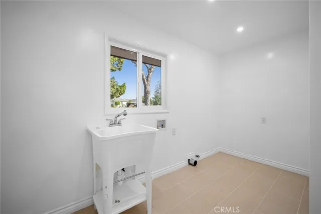 a bathroom with a sink a mirror and vanity