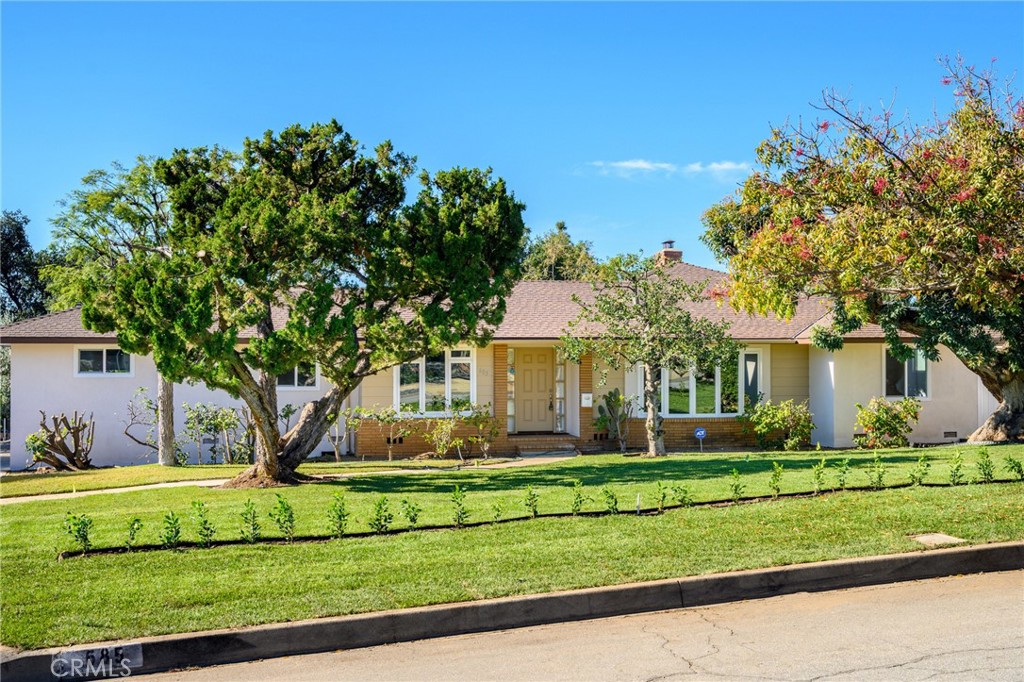 685 Rim Road Pasadena, CA 91107 - Photo 25 of 27 a front view of a house with a yard