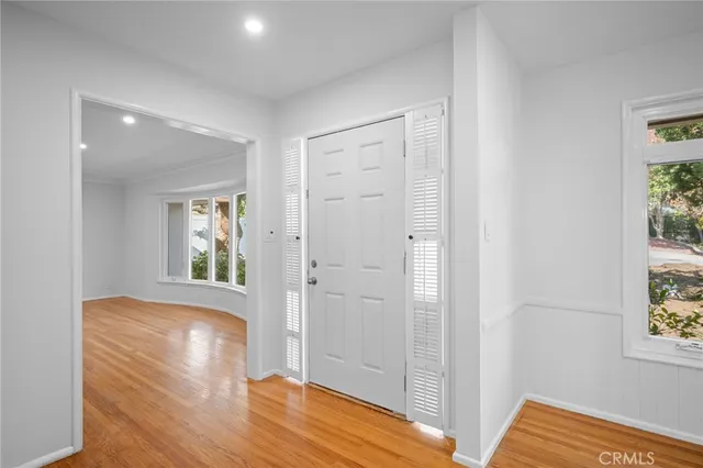 a view of room with window and wooden floor