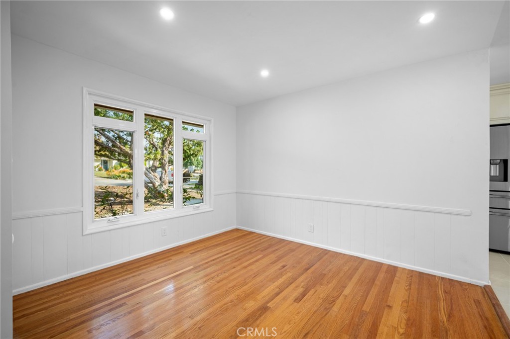 685 Rim Road Pasadena, CA 91107 - Photo 8 of 27 a view of empty room with wooden floor and fan