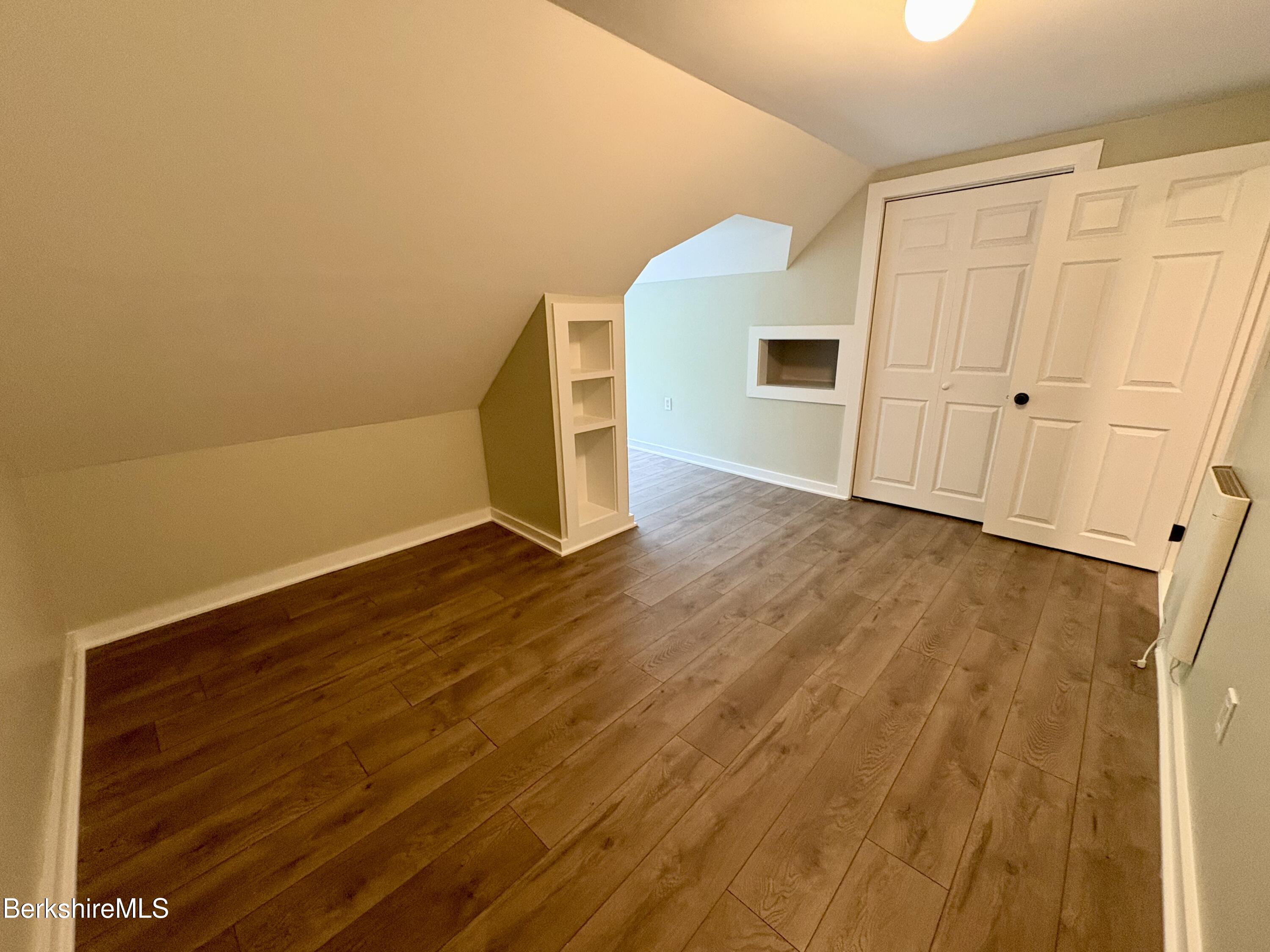 319 Old Columbia Street Adams, MA 01220 - Photo 14 of 15 a view of an empty room with wooden floor