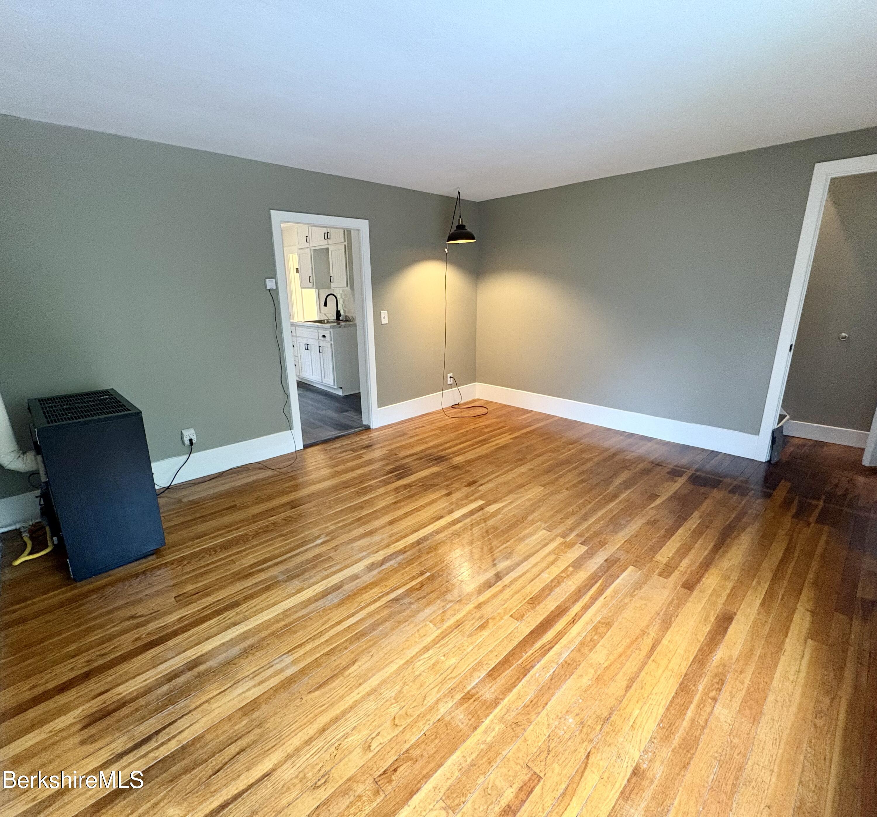 319 Old Columbia Street Adams, MA 01220 - Photo 4 of 15 a bedroom with a bed and a chair