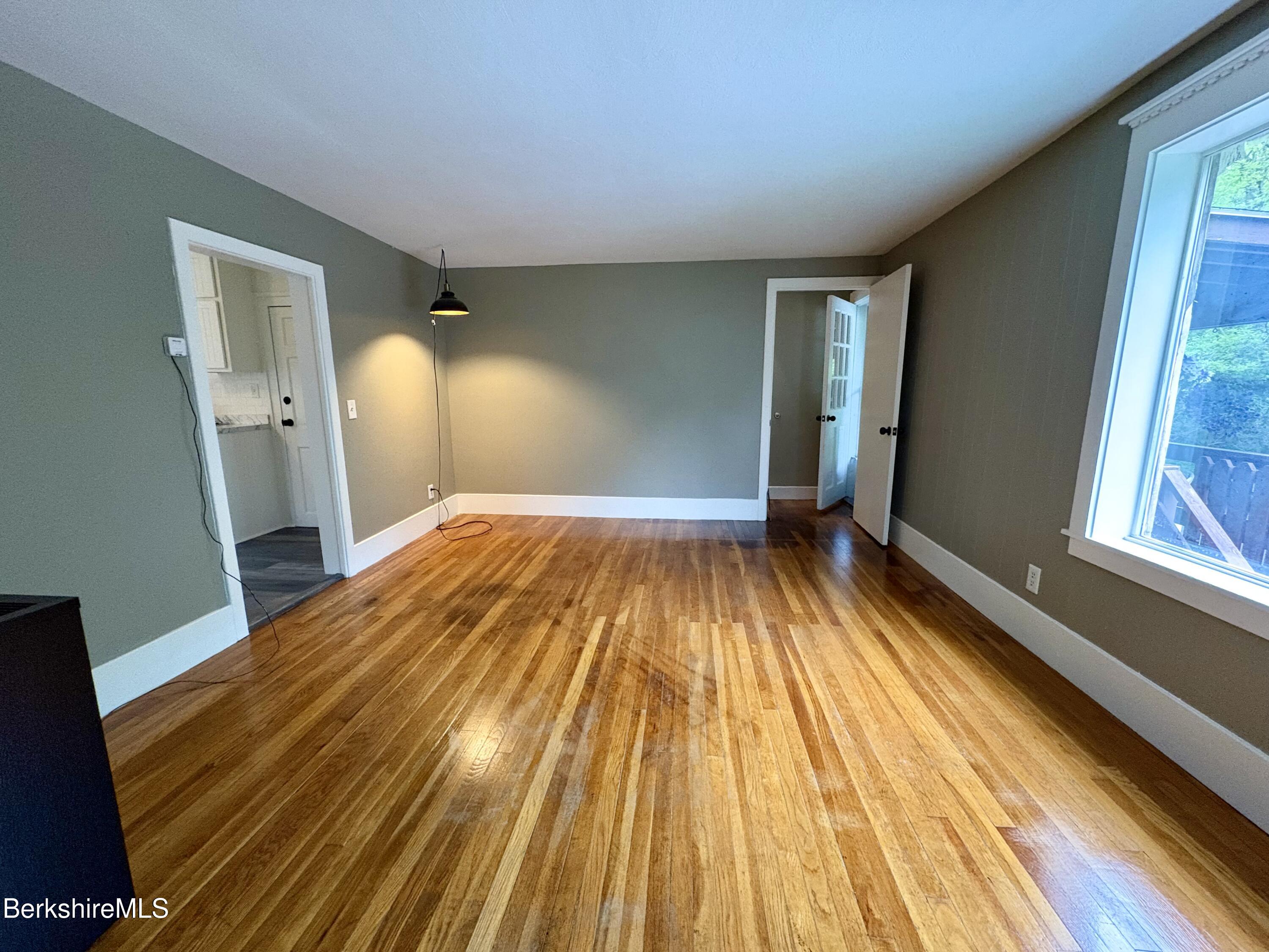 319 Old Columbia Street Adams, MA 01220 - Photo 5 of 15 a view of a room with wooden floor and staircase